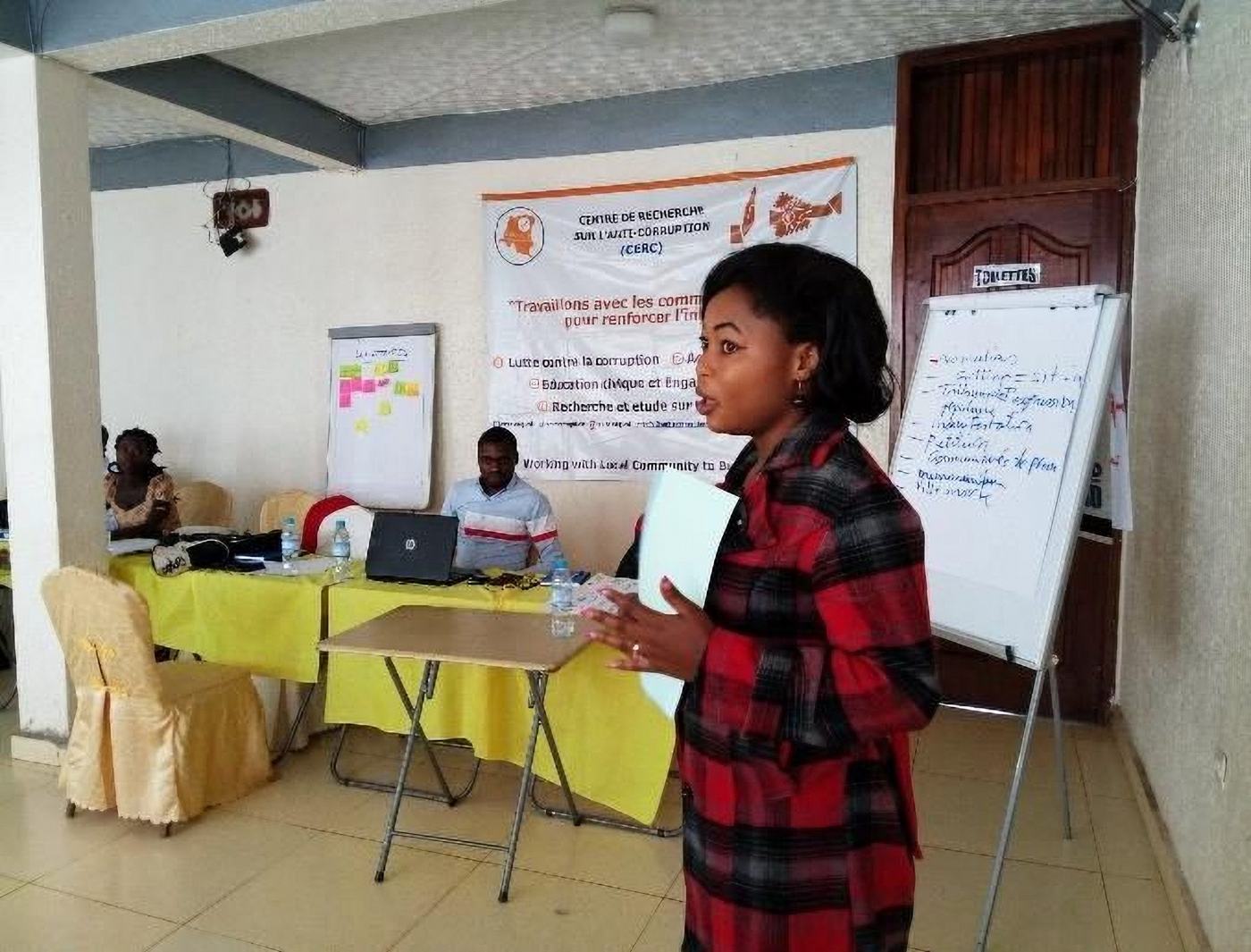 A participant presents at the Integrity Exchange Workshop