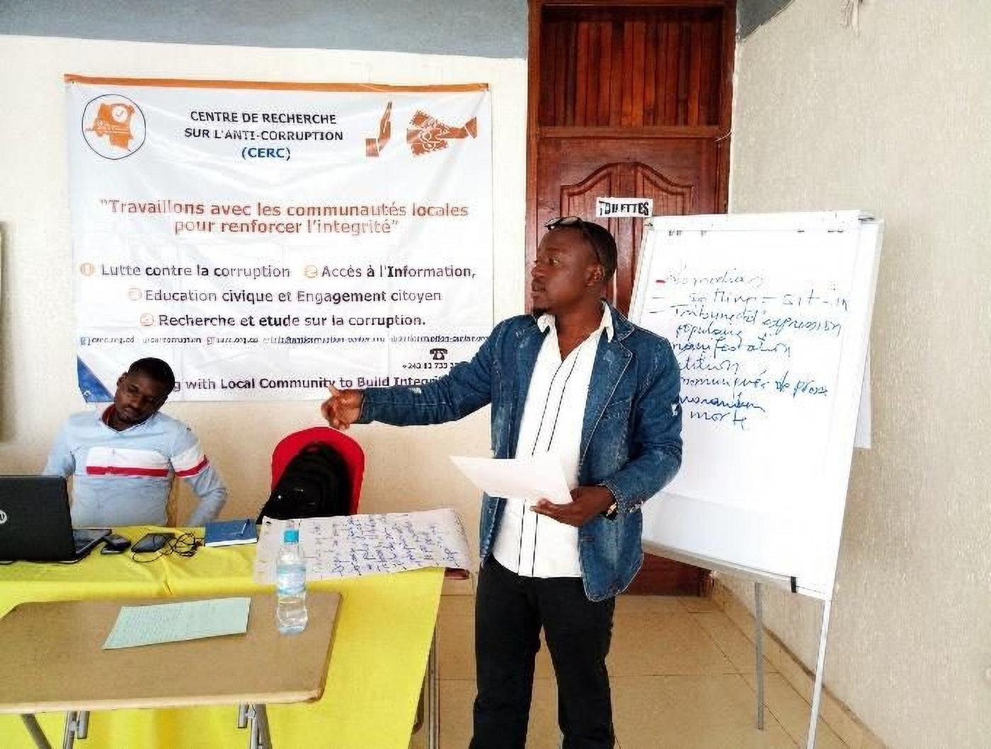 A participant presents at the Integrity Exchange Workshop