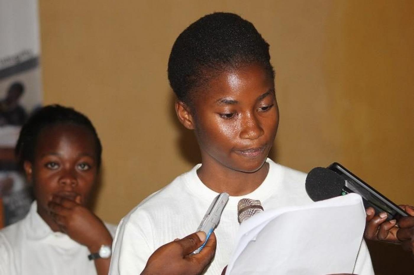 Students answer questions from journalists
