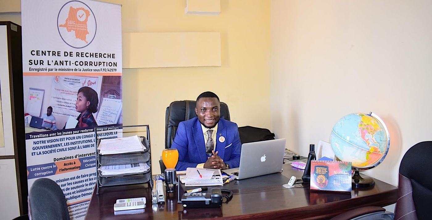 Heri Bitamala at his desk in the CERC office