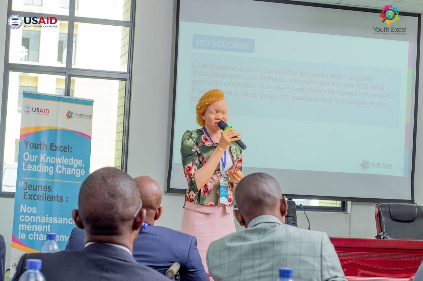 A participant presenting at the Youth Represent DRC Data Summit