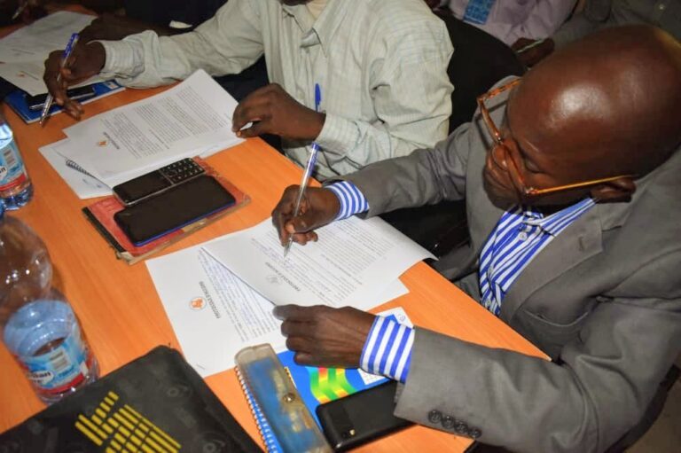 A workshop participant signing the memorandum of understanding